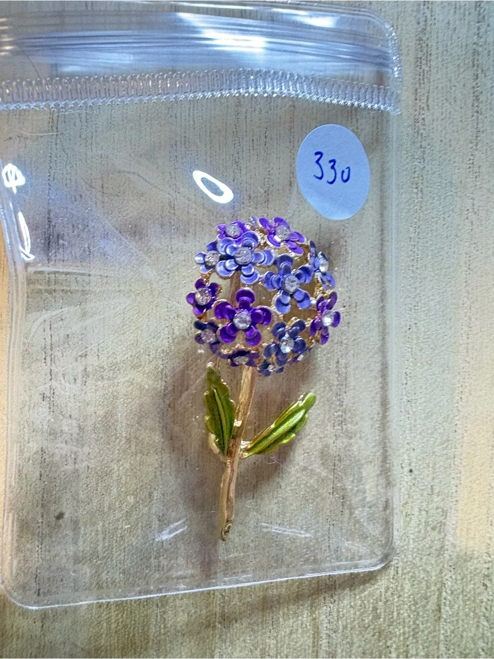 Purple Floral Cluster Brooch with Gold Stem and Green Leaves